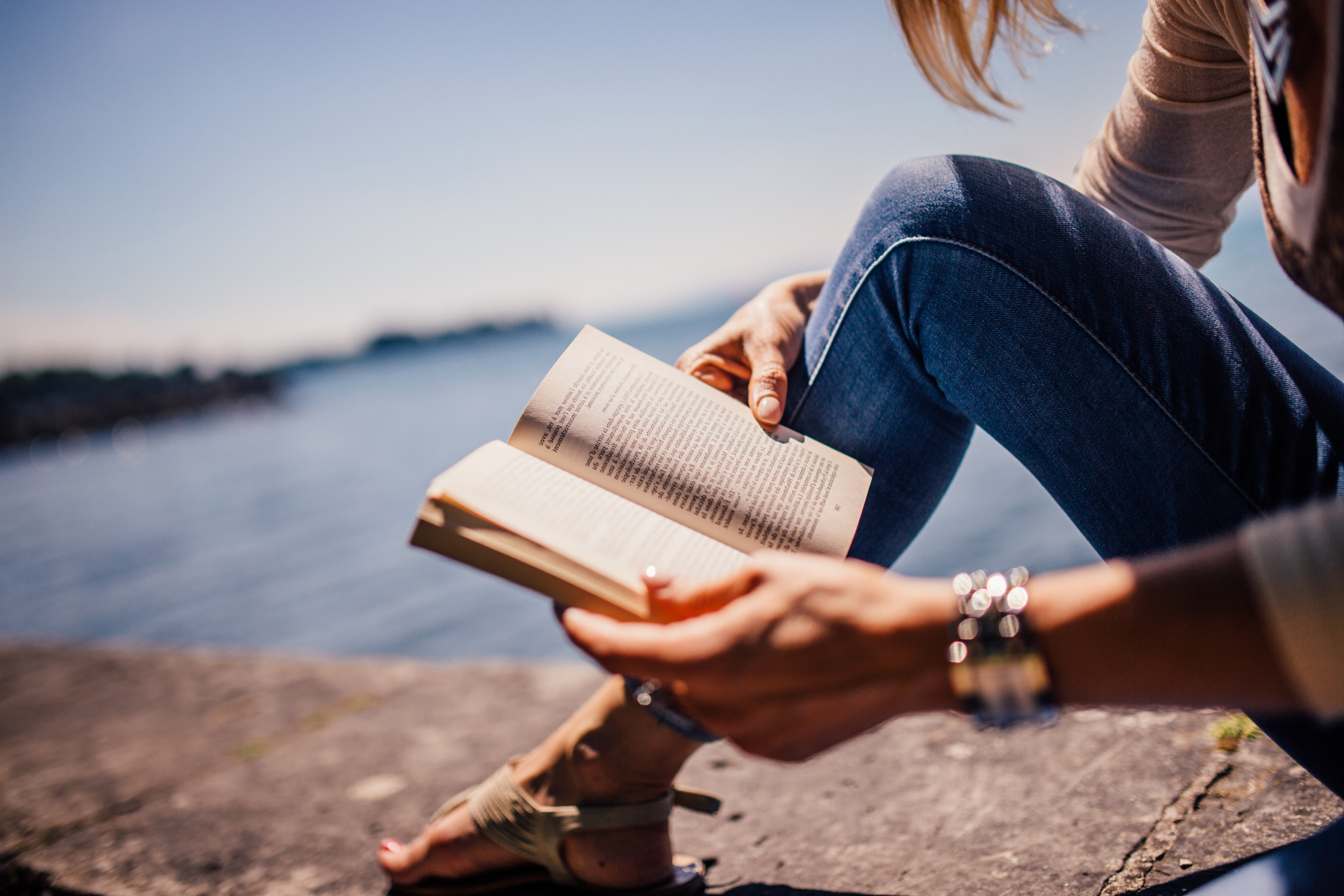 Girl reading book Cancer Care West